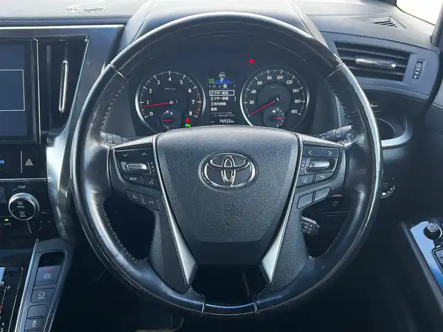 トヨタ ヴェルファイア 3.5ZA ゴールデンアイズ 道央・札幌 2016(平28)年 7.7万km グレーメタリック ４WD/純正SDナビ/AM/FM/BT/CD/DVD/フルセグ/純正フリップダウンモニター/衝突被害軽減ブレーキ/横滑り防止装置/レーダークルーズコントロール/クリアランスソナー/バックカメラ/ビルトインETC/ECOMODE/両側パワースライドドア/パワーバックドア/オットマン/ハーフレザーシート/革巻きウッドコンビステアリング/ステアリングリモコン/AC100V/電動パーキング/ブレーキホールド/MTモード付AT/プッシュスタート/スマートキー/LEDヘッドライト/オートライト/フォグランプ/電動格納ミラー/ウィンカーミラー/純正フロアマット/ドアバイザー