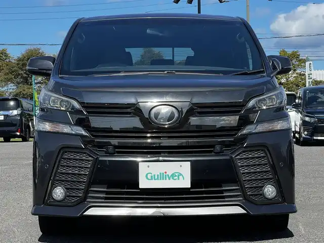 トヨタ ヴェルファイア 3.5ZA ゴールデンアイズ 道央・札幌 2016(平28)年 7.7万km グレーメタリック ４WD/純正SDナビ/AM/FM/BT/CD/DVD/フルセグ/純正フリップダウンモニター/衝突被害軽減ブレーキ/横滑り防止装置/レーダークルーズコントロール/クリアランスソナー/バックカメラ/ビルトインETC/ECOMODE/両側パワースライドドア/パワーバックドア/オットマン/ハーフレザーシート/革巻きウッドコンビステアリング/ステアリングリモコン/AC100V/電動パーキング/ブレーキホールド/MTモード付AT/プッシュスタート/スマートキー/LEDヘッドライト/オートライト/フォグランプ/電動格納ミラー/ウィンカーミラー/純正フロアマット/ドアバイザー