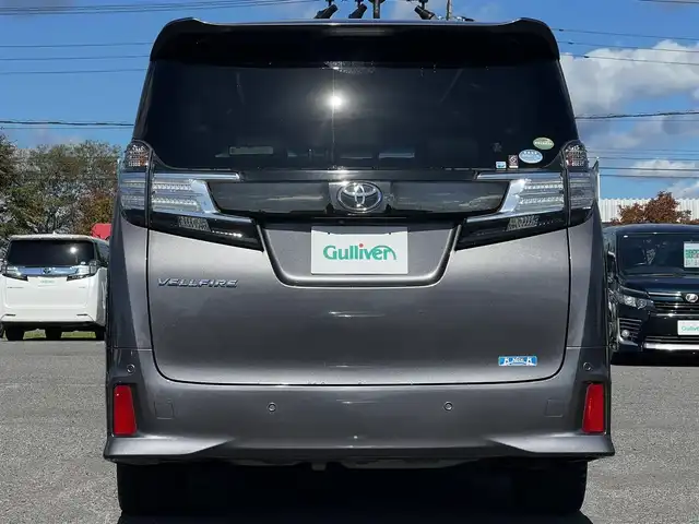 トヨタ ヴェルファイア 3.5ZA ゴールデンアイズ 道央・札幌 2016(平28)年 7.7万km グレーメタリック ４WD/純正SDナビ/AM/FM/BT/CD/DVD/フルセグ/純正フリップダウンモニター/衝突被害軽減ブレーキ/横滑り防止装置/レーダークルーズコントロール/クリアランスソナー/バックカメラ/ビルトインETC/ECOMODE/両側パワースライドドア/パワーバックドア/オットマン/ハーフレザーシート/革巻きウッドコンビステアリング/ステアリングリモコン/AC100V/電動パーキング/ブレーキホールド/MTモード付AT/プッシュスタート/スマートキー/LEDヘッドライト/オートライト/フォグランプ/電動格納ミラー/ウィンカーミラー/純正フロアマット/ドアバイザー