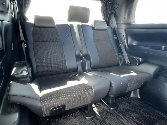 トヨタ ヴェルファイア 3.5ZA ゴールデンアイズ 道央・札幌 2016(平28)年 7.7万km グレーメタリック ４WD/純正SDナビ/AM/FM/BT/CD/DVD/フルセグ/純正フリップダウンモニター/衝突被害軽減ブレーキ/横滑り防止装置/レーダークルーズコントロール/クリアランスソナー/バックカメラ/ビルトインETC/ECOMODE/両側パワースライドドア/パワーバックドア/オットマン/ハーフレザーシート/革巻きウッドコンビステアリング/ステアリングリモコン/AC100V/電動パーキング/ブレーキホールド/MTモード付AT/プッシュスタート/スマートキー/LEDヘッドライト/オートライト/フォグランプ/電動格納ミラー/ウィンカーミラー/純正フロアマット/ドアバイザー