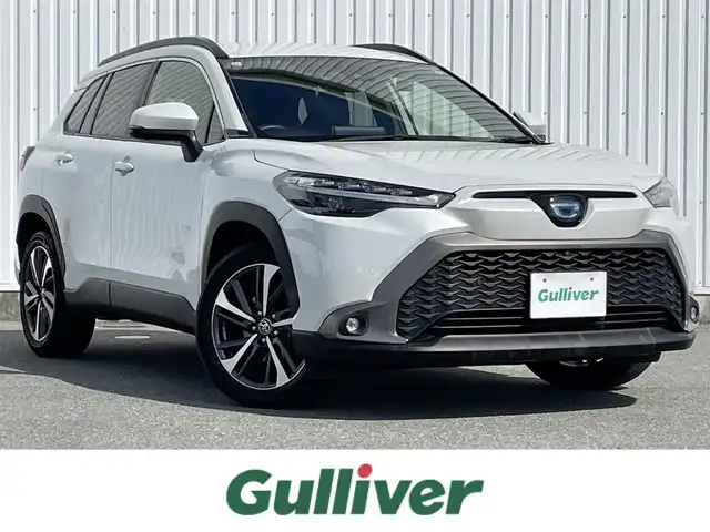 トヨタ カローラ クロス ハイブリッド Z 福岡県 2021(令3)年 3.1万km プラチナホワイトパールマイカ 禁煙車/トヨタセーフティセンス/PCS/LTA/ＢＳＭ/クリアランスソナー/PKSB/RCTA/純正９インチディスプレイオーディオ/フルセグTV/BT/AM/FM/applecarplay/androidauto/Miracast/全周囲カメラ/ルーフレール/ハンズフリーパワーバックドア/レーダークルーズコントロール/ハーフレザーシート/D席パワーシート/D/Nシートヒーター/ＬＥＤオートライト/フォグランプ/オートハイビーム/ステアリングリモコン/ビルトインETC/スマートキー/プッシュスタート/純正AW/電格ミラー/オートエアコン