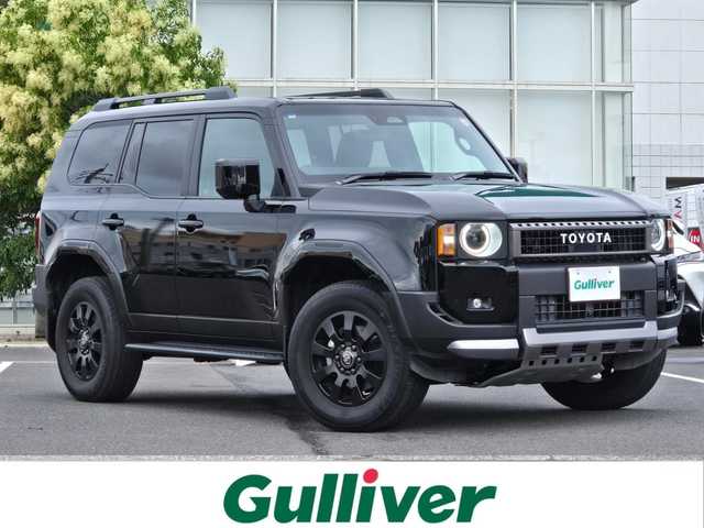 トヨタ ランドクルーザー ２５０ VX ファーストエディション 鹿児島県 2024(令6)年 1.7万km ブラック ワンオーナー　/ムーンルーフ　/モデリスタプロテクターキット　/モデリスタオーバーフェンダー　/ビルトインＥＴＣ２．０　/デジタルインナーミラー　/パノラミックビューモニター　/アダプティブクルーズコントロール/トヨタチームメイト/トヨタセーフティセンス/パワーバックドア/12.3インチ純正ディスプレイオーディオ/前後純正ドライブレコーダー/D+N席シートヒーター/エアシート/D席パワーシート/ＭＴモード付きＡＴ/ＨＤＭＩ入力端子/丸目型Bi-BeamLEDヘッドライト(OP装備)/前後コーナーセンサー/プッシュスタート/スマートキー