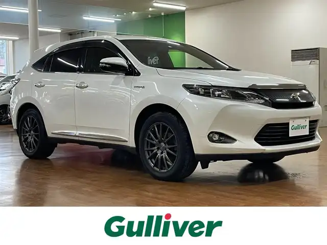 トヨタ ハリアー ハイブリッド エレガンス 道央・札幌 2014(平26)年 11.4万km ホワイトパールクリスタルシャイン 4WD/純正SDナビ/・フルセグTV/CD/DVD/BT/SD/USB/AUX/バックカメラ/社外エンジンスターター/本革シート/前席シートヒーター/前席パワーシート/運転席シートメモリ機能/ビルトインETC/プッシュスタート/スマートキー/スペアキー/緊急ブレーキシグナル/横滑り防止装置/純正フロアマット/純正ドアバイザー/ウインカーミラー/オートライト/LEDヘッドライト/前後フォグライト/社外18インチAW/純正AW付スタッドレスセット積込み/　（225/65R17  6mm）/新車時保証書/取扱説明書/ナビ取扱説明書