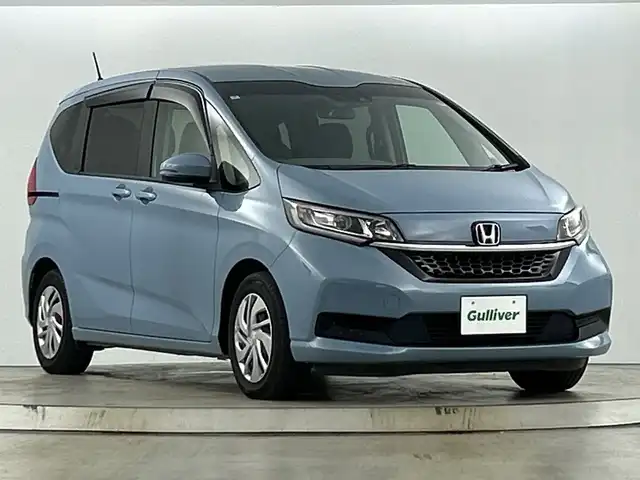 ホンダ フリード G ホンダセンシング 愛知県 2020(令2)年 6万km シーグラスブルーパール 禁煙車/純正7インチナビ/（CD/DVD/Bluetooth/ワンセグTV/SD)/バックカメラ/ホンダセンシング/・衝突軽減ブレーキ/・レーダークルーズコントロール/・レーンキープアシスト/ドライブレコーダー/ETC/シートヒーター/両側パワースライドドア/スマートキー/スペアキー有/プッシュスタート/純正フロアマット/横滑り防止装置/オートエアコン/オートライト