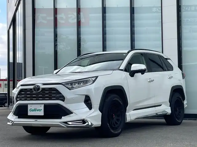 トヨタ ＲＡＶ４ G Zパッケージ 大阪府 2019(令1)年 8.4万km ホワイトパールクリスタルシャイン 純正９インチナビ/   フルセグTV/CD/DVD/Bluetooth/USB/衝突軽減ブレーキ/バックモニター/モデリスタエアロ　/ＤＥＬＴＡ／ＦＯＲＣＥアルミホイール/ブラインドスポットモニター/前後ドライブレコーダー/運転席メモリー付きパワーシート/前席シートヒーター/ステアリングヒーター/レーダークルーズコントロール/レーントレーシングアシスト/ダウンヒルアシストコントロール/100V電源/スマートルームミラー/オートマチックハイビーム/コーナーセンサー/ルーフレール/ＥＴＣ/ＬＥＤライト