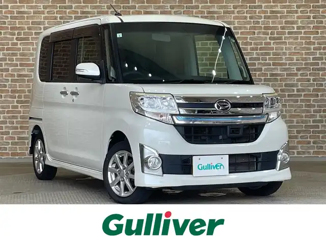 ダイハツ タント カスタム X トップED SA 岩手県 2015(平27)年 6.4万km パールホワイトⅢ ４WD/社外ナビ（Bluetooth CD DVD USB フルセグ）/衝突被害軽減ブレーキ/片側パワースライドドア/スマートアシスト/バックカメラ/アイドリングストップ/誤発進抑制機能/ステアリングスイッチ/LEDヘッドライト/横滑り防止装置/純正１４インチアルミホイール/フォグランプ/オートエアコン/オートライト/ロールサンシェード/ベンチシート/ドアミラーウインカー