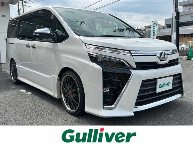 トヨタ ヴォクシー ZS 煌 大阪府 2018(平30)年 3.7万km ホワイトパールクリスタルシャイン アルパイン１１型ナビ／フルセグ／ＤＶＤ／ＣＤ／ＢＴ/バックカメラ/ビルトインＥＴＣ/ドライブレコーダー/アルパイン１２．８型フリップダウン/ＴＥＩＮ車高調/社外１９インチアルミホイール/純正アルミサマータイヤセット積込/トヨタセーフティセンス/レーンキープアシスト/両側パワースライドドア/LEDヘットライト/フォグライト/プッシュエンジンスタート/ウィンカーミラー/リヤルーフスポイラー/フロアマット/ドアバイザー