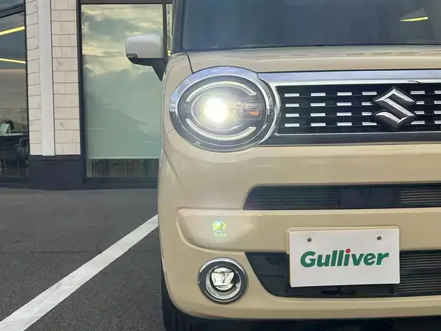 スズキ ワゴンＲ スマイル HYBRID X 愛媛県 2022(令4)年 0.8万km シフォンアイボリーメタリック 社外7インチナビ/CD/DVD/Bluetooth/フルセグTV/USB/バックカメラ/両側パワースライドドア/スズキセーフティサポート/デュアルカメラブレーキサポート/車線逸脱警報/前後誤発進抑制機能/ふらつき警報/先行車発進お知らせ機能/シートヒーター/オートライト/LEDヘッドライト/フロントフォグ/ETC/プッシュスタート