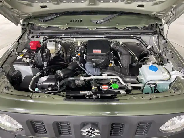 スズキ ジムニー XL 福岡県 2019(令1)年 1.8万km ジャングルグリーン ・ワンオーナー/・５速ＭＴ　/・社外オーディオ　/（ＡＭ　ＦＭ　ＵＳＢ　ＣＤ）　/・ダウンヒルアシスト　/・衝突軽減システム　/・レーンキープ　/・横滑り防止　/・シートヒーター　/・背面タイヤ　/・オートライト　/・ハロゲンヘッドライト　/・電格ミラー/・スペアキー