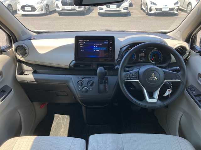 三菱 ｅＫワゴン M 愛媛県 2024(令6)年 0.3万km ホワイト 禁煙車 /純正9インチナビ(MM223D-LM) /・フルセグTV/Bluetooth/SD /バックカメラ /安全装置/・衝突軽減ブレーキ /・車線逸脱警報 /・先行車発信お知らせ /・速度/道路標識認識機能 /・コーナーセンサー /・ふらつき警報/リモコンキー/・スペアキー/アイドリングストップ/前座席シートヒーター /取扱説明書