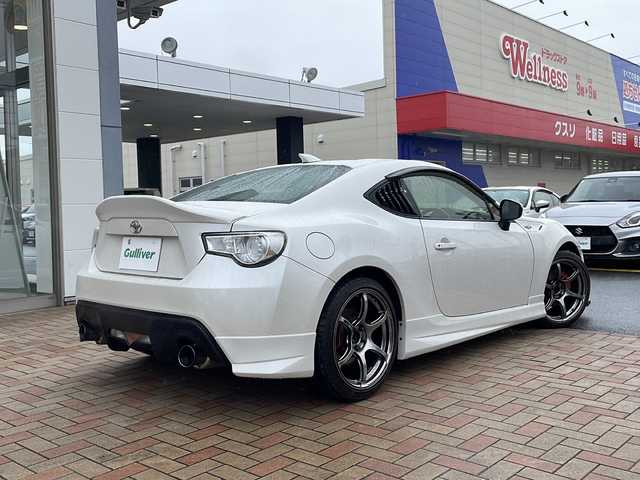 トヨタ ８６ GT 鳥取県 2012(平24)年 7.9万km サテンホワイトパール モデリスタエアロ/アドバン18インチAW/柿本改マフラー/社外ディスプレイオーディオ/社外ヘッドライト/社外テールライト（純正あり）/社外リップスポイラー/社外ステアリング/社外インテリアパネル/アペックス車高調（積込）/ボンネットラッピング