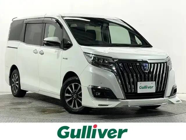 トヨタ エスクァイア ハイブリッド Gi 大阪府 2017(平29)年 5.4万km ホワイトパールクリスタルシャイン 社外エアロ 黒革シート 純正9incナビTV バックカメラ フリップダウンモニター シートヒーター クルーズコントロール 衝突軽減ブレーキ レーンアシスト オートハイビーム 両側パワースライドドア 前後ドライブレコーダー ETC