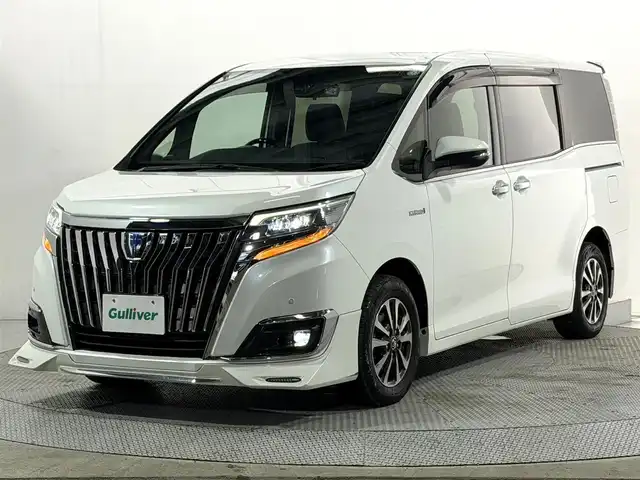 トヨタ エスクァイア ハイブリッド Gi 大阪府 2017(平29)年 5.4万km ホワイトパールクリスタルシャイン 社外エアロ 黒革シート 純正9incナビTV バックカメラ フリップダウンモニター シートヒーター クルーズコントロール 衝突軽減ブレーキ レーンアシスト オートハイビーム 両側パワースライドドア 前後ドライブレコーダー ETC