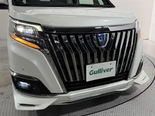 トヨタ エスクァイア ハイブリッド Gi 大阪府 2017(平29)年 5.4万km ホワイトパールクリスタルシャイン 社外エアロ 黒革シート 純正9incナビTV バックカメラ フリップダウンモニター シートヒーター クルーズコントロール 衝突軽減ブレーキ レーンアシスト オートハイビーム 両側パワースライドドア 前後ドライブレコーダー ETC