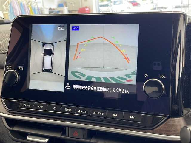 日産 オーラ G レザーエディション 千葉県 2023(令5)年 1.9万km ピュアホワイトパール プロパイロット/　衝突被害軽減システム/コーナーセンサー（前後）/　ブラインドスポットモニター/レーンキープアシスト/　レーダークルーズコントロール/横滑り防止/　オートライト/LEDヘッドライト/デジタルインナーミラー/BOSEサウンド/ワイヤレス充電/純正メモリナビ/　（Bluetooth/USB/フルセグTV）/車外カメラ/　（バック/全方位）/純正ビルトインETC2.0/純正ドライブレコーダー（前方のみ）/シートヒーター（D/N席）/純正フロアマット/パワーステアリング/ステアリングヒーター/純正17インチアルミホイール