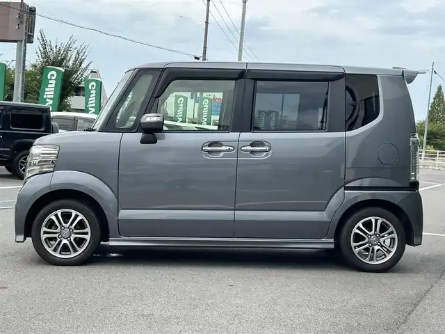 ホンダ Ｎ ＢＯＸ カスタム G Lパッケージ 愛媛県 2015(平27)年 6.1万km ポリッシュドメタルメタリック 純正7型ナビ(AM/FM/CD/DVD/BTワンセグTV)/左側電動スライド/ドライブレコーダー/バックカメラ/純正フロアマット/ステアリングリモコン/電格ミラー/純正ドアバイザー/シガーソケット/ISOFIX/フォグランプ/オートライト/ETC/現状サマー(純正AW)(155/65/R14)/TOYO SD-K7