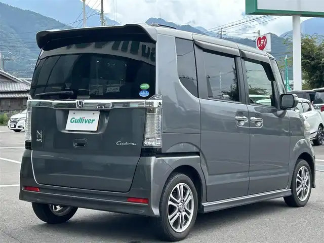 ホンダ Ｎ ＢＯＸ カスタム G Lパッケージ 愛媛県 2015(平27)年 6.1万km ポリッシュドメタルメタリック 純正7型ナビ(AM/FM/CD/DVD/BTワンセグTV)/左側電動スライド/ドライブレコーダー/バックカメラ/純正フロアマット/ステアリングリモコン/電格ミラー/純正ドアバイザー/シガーソケット/ISOFIX/フォグランプ/オートライト/ETC/現状サマー(純正AW)(155/65/R14)/TOYO SD-K7