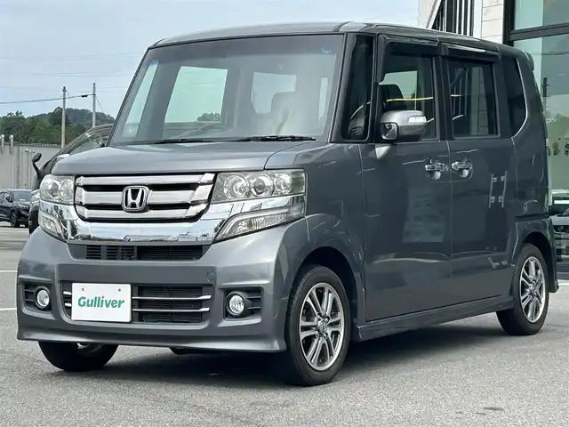 ホンダ Ｎ ＢＯＸ カスタム G Lパッケージ 愛媛県 2015(平27)年 6.1万km ポリッシュドメタルメタリック 純正7型ナビ(AM/FM/CD/DVD/BTワンセグTV)/左側電動スライド/ドライブレコーダー/バックカメラ/純正フロアマット/ステアリングリモコン/電格ミラー/純正ドアバイザー/シガーソケット/ISOFIX/フォグランプ/オートライト/ETC/現状サマー(純正AW)(155/65/R14)/TOYO SD-K7