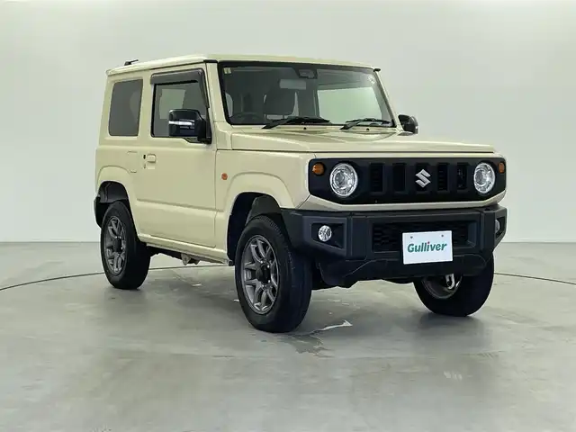 スズキ ジムニー XC 福井県 2023(令5)年 0.8万km シフォンアイボリーM 純正ナビ/（CD/DVD/SD/BT/フルセグTV）/バックカメラ/シートヒーター/デュアルセンサーブレーキサポート/誤発進抑制機能/車線逸脱警報機能/ハイビームアシスト/ふらつき警報機能/先行車発信お知らせ機能/標識認識機能/スマートキー/電動格納ウィンカーミラー/ステアリングリモコン/フォグランプ