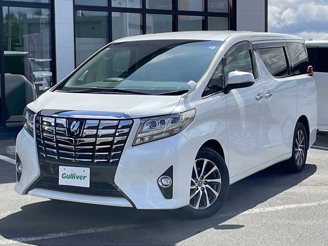 トヨタ アルファード G 道東・釧路十勝 2015(平27)年 5.4万km ホワイトパールクリスタルシャイン ・4WD/・純正10インチメモリナビ/（CD・DVD・BT・AM・FM・フルセグ・）/・バックカメラ/・純正11インチフリップダウンモニター/・プリクラッシュセーフティ/・両側パワースライドドア/・パワーバックドア/・レーダークルーズコントロール/・オートマチックハイビーム/・前方ドライブレコーダー/・LEDオートライト/・フォグランプ/・合皮ハーフレザーシート/・前席パワーシート/・運転席シートメモリー/・助手席オットマン/・クリアランスソナー/・アイドリングストップ/・スマートキー/・プッシュスタート/・ビルトインETC/・純正17インチアルミホイール