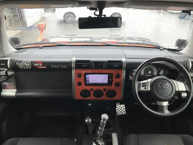 トヨタ ＦＪクルーザー カラーパッケージ 富山県 2014(平26)年 5.9万km オレンジ/ホワイト 4WD/社外ナビ/フルセグTV/Bluetooth/ドライブレコーダー/デジタルインナーミラー/コーナーセンサー/クルーズコントロール/革巻きステアリング/ステアリングスイッチ/背面タイヤ/ルーフレール/ETC