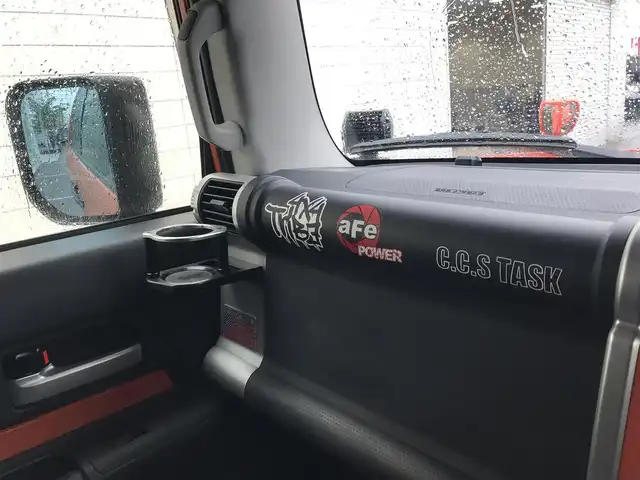 トヨタ ＦＪクルーザー カラーパッケージ 富山県 2014(平26)年 5.9万km オレンジ/ホワイト 4WD/社外ナビ/フルセグTV/Bluetooth/ドライブレコーダー/デジタルインナーミラー/コーナーセンサー/クルーズコントロール/革巻きステアリング/ステアリングスイッチ/背面タイヤ/ルーフレール/ETC