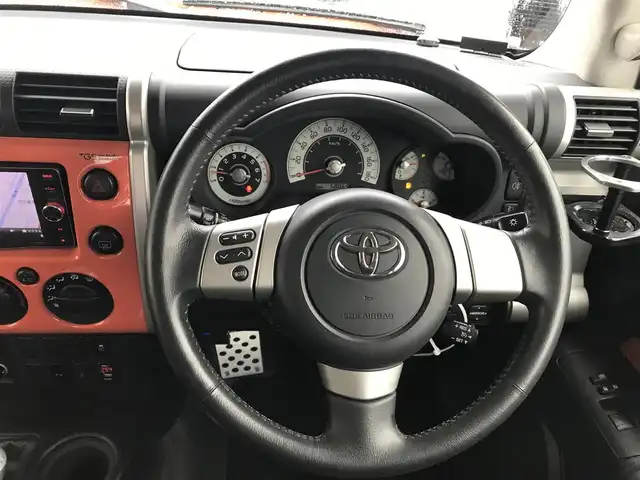 トヨタ ＦＪクルーザー カラーパッケージ 富山県 2014(平26)年 5.9万km オレンジ/ホワイト 4WD/社外ナビ/フルセグTV/Bluetooth/ドライブレコーダー/デジタルインナーミラー/コーナーセンサー/クルーズコントロール/革巻きステアリング/ステアリングスイッチ/背面タイヤ/ルーフレール/ETC