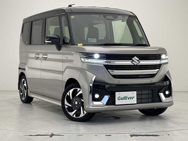 スズキ スペーシア カスタム HYBRID XS 沖縄県 2023(令5)年 0.1万km未満 スチールシルバーメタリック/ブルーイッシュブラックパール 社外ディスプレイオーディオ　/ＢＴ接続　/バックカメラ　/両側パワースライドドア　/ドライブレコーダー　/ＥＴＣ　/ＬＥＤヘッドライト　/ハーフレザーシート　/シートヒーター　/オットマン　/プッシュスタート　/スマートキー