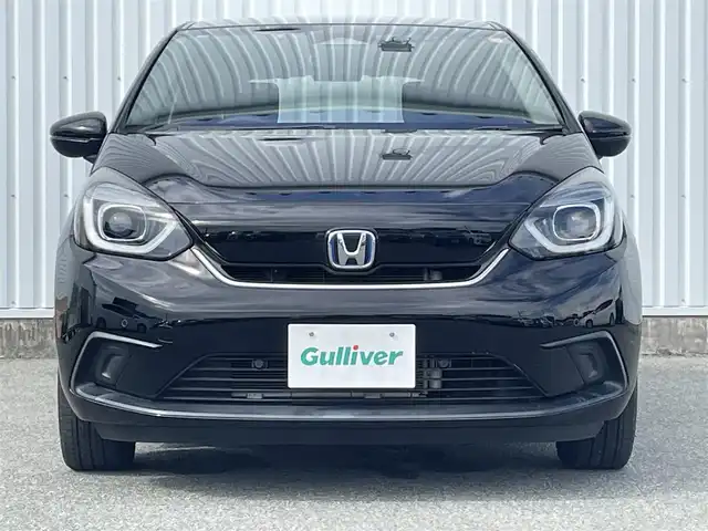 ホンダ フィット e:HEVホーム 福岡県 2021(令3)年 2.5万km クリスタルブラックパール ホンダセンシング/純正９インチナビ（ＶＸＵ－２１５ＦＴｉ）/フルセグTV/CD/DVD/BT/SD/バックカメラ/パーキングセンサー/ＡＣＣ/ドライブレコーダー/ＬＥＤオートライト/オートハイビーム/ビルトインＥＴＣ/スマートキー/プッシュスタート/電動パーキング/ブレーキホールド