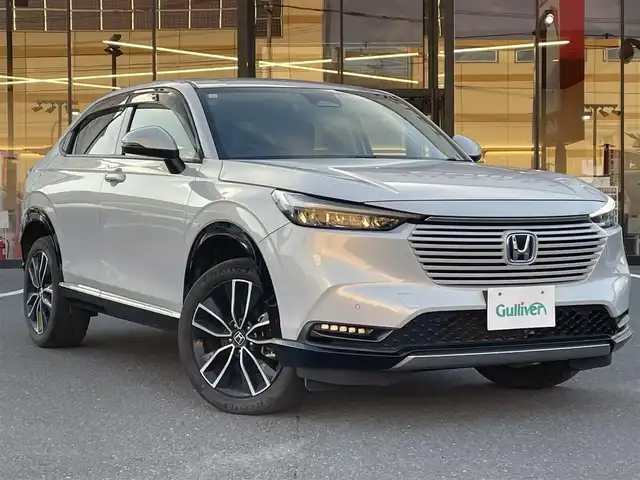 ホンダ ヴェゼル ハイブリッド e:HEV Z 宮城県 2021(令3)年 5.3万km プレミアムサンライトホワイトパール 登録時走行距離52952km/純正ナビ/CD/DVD/Bluetooth/ワンセグTV/シーケンシャルウインカー/純正アルミホイール/置くだけ充電/電動リアゲート/ブラインドスポットモニター/追従クルーズコントロール/パーキングアシスト/シートヒーター/ステアリングヒーター/パドルシフト/LEDフォグランプ/バックカメラ/ETC/ドライブレコーダー