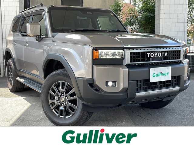 トヨタ ランドクルーザー ２５０ VX 京都府 2024(令6)年 0.6万km アバンギャルドブロンズメタリック 12.3インチ純正ディスプレイオーディオナビ /フルセグTV/Bluetooth/USB/Miracast/パノラミックビューモニター /ムーンルーフ /禁煙/デジタルインナーミラー /ウィンカーミラー/BSM /前後コーナーセンサー /純正ドライブレコーダー/LEDヘッドライト/オートライト/オートマチックハイビーム/フロントフォグランプ /純正AW18インチ/クルコン追従有/レーンキープアシスト/パワーシート/シートヒーター/エアシート/Wサイドエアバッグ/カーテンエアバッグ