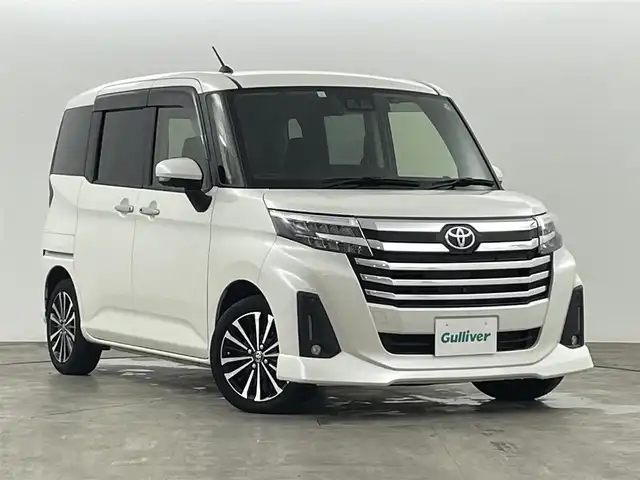 トヨタ ルーミー カスタムG－T 福島県 2023(令5)年 2.3万km パール スマートアシスト/・衝突被害軽減ブレーキ/・車線逸脱警報装置/・誤発進抑制装置/・ふらつき警報/・先行車発進お知らせ/純正7インチナビゲーション/・型番：NMZK-W73D/・フルセグTV/BT/USB/SD/CD/DVD/FM/AM/・ETC/・アラウンドビューモニター/・バックカメラ/両側パワースライドドア/革張ステアリング/・ステアリングリモコン/・クルーズコントロール追従あり/D+N席シートヒーター/アイドリングストップ/電子パーキングホールド/ブレーキホールド/プッシュスタート/・スマートキー/LEDヘッドライト/・フォグライト/・オートライト/・オートハイビーム/電動格納ミラー/・オートミラー/・ウィンカーミラー/前後コーナーセンサー/純正15インチアルミ/純正フロアマット