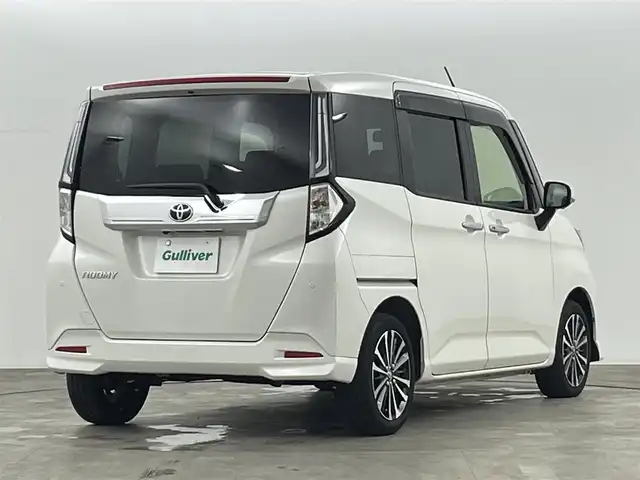 トヨタ ルーミー カスタムG－T 福島県 2023(令5)年 2.3万km パール スマートアシスト/・衝突被害軽減ブレーキ/・車線逸脱警報装置/・誤発進抑制装置/・ふらつき警報/・先行車発進お知らせ/純正7インチナビゲーション/・型番：NMZK-W73D/・フルセグTV/BT/USB/SD/CD/DVD/FM/AM/・ETC/・アラウンドビューモニター/・バックカメラ/両側パワースライドドア/革張ステアリング/・ステアリングリモコン/・クルーズコントロール追従あり/D+N席シートヒーター/アイドリングストップ/電子パーキングホールド/ブレーキホールド/プッシュスタート/・スマートキー/LEDヘッドライト/・フォグライト/・オートライト/・オートハイビーム/電動格納ミラー/・オートミラー/・ウィンカーミラー/前後コーナーセンサー/純正15インチアルミ/純正フロアマット
