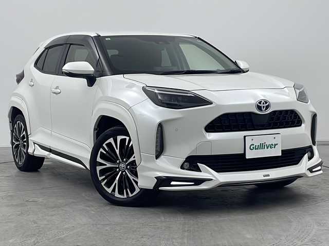 トヨタ ヤリスクロス ハイブリッド Z 三重県 2021(令3)年 6.4万km ホワイトパールクリスタルシャイン 禁煙車/モデリスタフルエアロ/Toyota Safety Sense	/・プリクラッシュセーフティ	/・レーントレーシングアシスト	/・レーダークルーズコントロール	/・ロードサインアシスト	/・発進遅れ告知機能	/・プロアクティブドライビングアシスト	/・オートマチックハイビーム	/ブラインドスポットモニター/ヘッドアップディスプレイ/純正ディスプレイオーディオ（ナビあり）/BT.USB.Miracast/バックカメラ/ビルトインETC2.0/電動パーキングブレーキ/オートホールド/LEDヘッドライト/ハーフレザーシート/シートヒーター/パワーシート/プッシュスタート/スマートキーｘ２