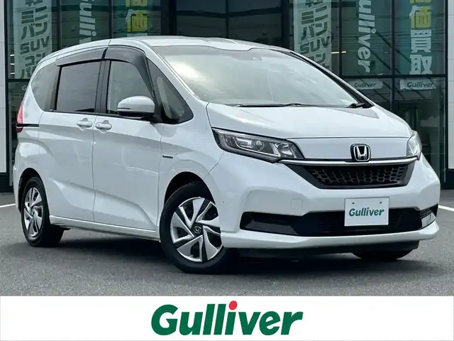 ホンダ フリード ハイブリット G ホンダセンシング 岡山県 2020(令2)年 4万km プラチナホワイトパール 登録時走行距離39814km/KENWOOD8インチナビ/（AM.FM.BT.TV.CD.DVD）/ALPINEフリップダウンモニター/バックカメラ/両側パワースライドドア/ホンダセンシング/・オートマチックハイビーム/・レーンディパーチャアラート/・レーダークルーズコントロール/・衝突軽減ブレーキ/ビルトインETC/シートヒーター
