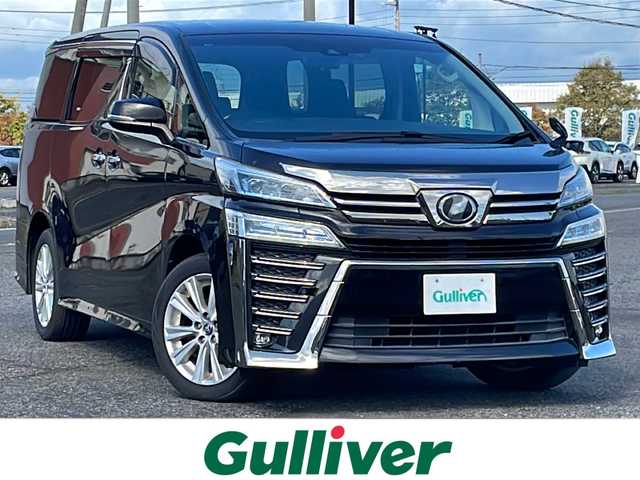 トヨタ ヴェルファイア Z 道央・札幌 2018(平30)年 5.2万km バーニングブラッククリスタルシャインガラスフレーク ４WD/純正ディーラーOPナビ/AM/FM/BT/SD/DVD/フルセグ/トヨタセーフティセンス/衝突被害軽減ブレーキ/レーダークルーズコントロール/レーンキープアシスト/クリアランスソナー/バックカメラ/ビルトインETC/ドライブレコーダー/アイドリングストップ/ECOMODE/両側パワースライドドア/革巻きステアリング/ステアリングリモコン/電動パーキング/ブレーキホールド/MTモード付AT/プッシュスタート/スマートキー/LEDヘッドライト/オートライト/オートマチックハイビーム/フォグランプ/電動格納ミラー/ウィンカーミラー/純正フロアマット/ドアバイザー