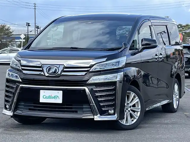 トヨタ ヴェルファイア Z 道央・札幌 2018(平30)年 5.2万km バーニングブラッククリスタルシャインガラスフレーク ４WD/純正ディーラーOPナビ/AM/FM/BT/SD/DVD/フルセグ/トヨタセーフティセンス/衝突被害軽減ブレーキ/レーダークルーズコントロール/レーンキープアシスト/クリアランスソナー/バックカメラ/ビルトインETC/ドライブレコーダー/アイドリングストップ/ECOMODE/両側パワースライドドア/革巻きステアリング/ステアリングリモコン/電動パーキング/ブレーキホールド/MTモード付AT/プッシュスタート/スマートキー/LEDヘッドライト/オートライト/オートマチックハイビーム/フォグランプ/電動格納ミラー/ウィンカーミラー/純正フロアマット/ドアバイザー