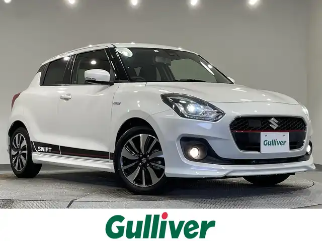 スズキ スイフト HYBRID RS 愛知県 2019(平31)年 1.3万km ピュアホワイトP 純正８インチＳＤナビ/（Bluetooth/フルセグTV/SD/CD・DVD再生）　/衝突軽減ブレーキ　/シートヒーター　/ビルトインＥＴＣ　/ドライブレコーダー　/ＬＥＤヘッドライト　/レーンアシスト/パドルシフト　/フォグランプ　/純正フロアマット/純正１６インチアルミ