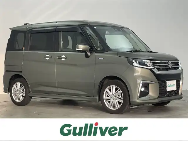 スズキ ソリオ HV MZ 埼玉県 2023(令5)年 0.9万km タフカーキパールメタリック 純正９インチナビ　全周囲カメラ　　両側パワースライドドア　ＨＵＤ　レーダークルーズコントロール　ＬＥＤヘッドライト　プッシュスタート　スマートキー　地デジフルセグ　前後ドライブレコーダー