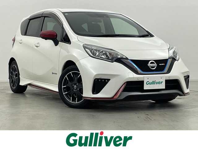 日産 ノート e－パワー ニスモ 群馬県 2018(平30)年 6万km ブリリアントホワイトパール インテリジェントクルーズコントロール/インテリジェントLI(車線逸脱防止支援システム)/アラウンドビューモニター/インテリジェントルームミラー/LEDヘッドライト/＝＝＝＝＝＝/純正7インチナビ(MM518D-W)/AM/FM/CD/DVD/BT/AUX/フルセグ/ETC/ナビ連動ドライブレコーダー(DJ4-D)/エマージェンシーブレーキ/車線逸脱警報(LDW)/踏み間違い衝突防止アシスト/フロント&バックソナー/NISMO専用スエード調スポーツシート/スマートキー/プッシュスタート
