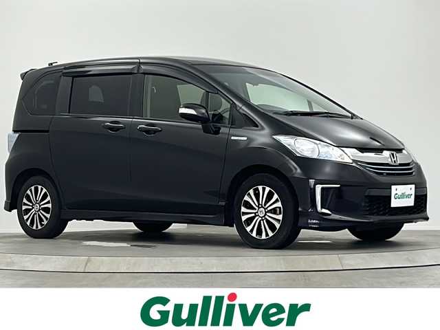 ホンダ フリード ハイブリット ジャストセレクション 大阪府 2014(平26)年 5万km プレミアムスパークルブラックパール 純正8インチインターナビ【VXM-145VFNi】/【AM/FM/CD/DVD/Bluetooth/フルセグTV】/純正フリップダウンモニター【VM-108N】/社外前方ドライブレコーダー【DRY-FU538P】/バックカメラ/ビルトインETC/両側電動パワースライドドア/クルーズコントロール/ハーフレザーシート/AAC/純正15インチAW/純正フロアマット
