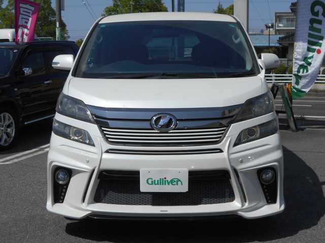 トヨタ ヴェルファイア 2．4Z ゴールデンアイズ 愛知県 2013(平25)年 9.4万km ホワイトパールクリスタルシャイン アルパイン９インチナビ/Bluetooth/DVD/フルセグテレビ/フリップダウンモニター/バックカメラ/ETC/両側パワースライドドア/パワーバックドア/HIDヘッドライト/スマートキー２個/プッシュスタート/シルクブレイズエアロバンパー/RAYS20インチアルミ/純正アルミ・スタッドレスタイヤ4本積込/保証書・取説・ナビ取説あり
