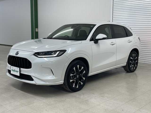 ホンダ ＺＲ－Ｖ ハイブリッド e:HEV Z 熊本県 2023(令5)年 2.6万km プラチナホワイトパール 純正ディスプレイオーディオ（ＢＴ/ラジオ/フルセグ）/全方位カメラ/前方ドライブレコーダー/ビルトインETC2.0/コーナーセンサー/パドルシフト/MTモード付AT/USB/ブレーキホールド/パワーシート/シートメモリー/シートヒーター/ステアリングヒーター/置くだけ充電/クルーズコントロール追従あり/ブラインドスポット/踏み間違え防止/BOSEサウンド
