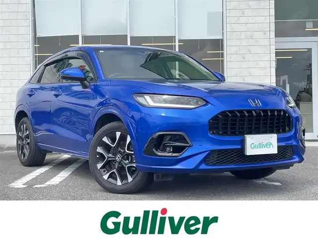 ホンダ ＺＲ－Ｖ ハイブリッド e:HEV Z 宮崎県 2023(令5)年 2.4万km プレミアムクリスタルブルークリスタル 純正ナビゲーション/　AM FM BT　TV/全方位カメラ/ETC車載器/ドライブレコーダー/パドルシフト/レーダークルーズコントロール/衝突軽減ブレーキ/LEDヘッドライト/フォグランプ　/パワーバックドア/パワーシート/シートヒーター/プッシュスタート/スマートキー