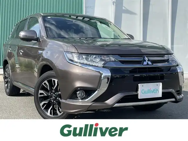 三菱 アウトランダー ＰＨＥＶ G プレミアムパッケージ 福岡県 2016(平28)年 7.3万km クォーツブラウンメタリック ハンドルヒーター/パワーステアリング/純正ナビ/純正フロアマット/ドライブレコーダー(前後)/レザーシート/Bluetooth/ETC/クルーズコントロール/プッシュスタート/横滑り防止装置/衝突被害軽減システム/100V充電/ETC/W+Sエアバッグ