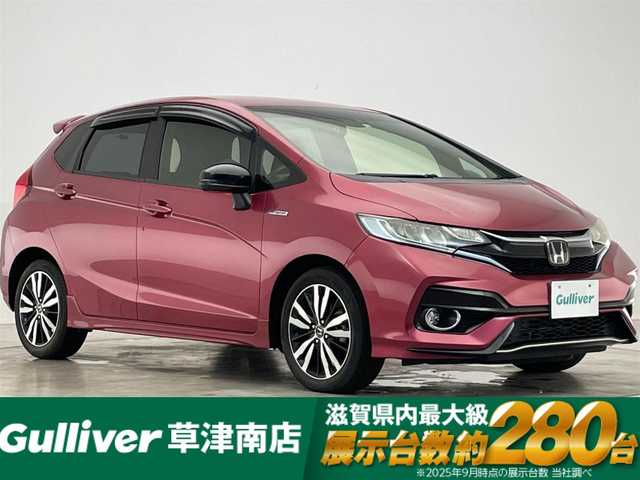 ホンダ フィット ハイブリット S ホンダセンシング 滋賀県 2018(平30)年 4.3万km ルージュアメジストM 純正ディスプレイオーディオ/CD.ワンセグ/バックカメラ/ホンダセンシング/●衝突軽減ブレーキ〈CMBS〉/●誤発進抑制機能/●歩行者事故低減ステアリング/●路外逸脱抑制機能/●ACC〈アダプティブ・クルーズ・コントロール〉/●LKAS〈車線維持支援システム〉/●先行車発進お知らせ機能/●標識認識機能/ステアリングスイッチ/パドルシフト/前後ドライブレコーダー/ビルトインETC/LEDヘッドライト/オートライト/スマートキー/スペアキー
