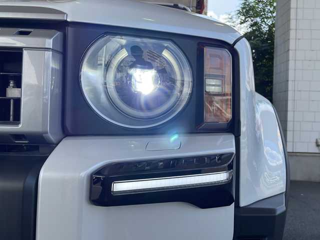 トヨタ ランドクルーザー ２５０ VX 徳島県 2024(令6)年 0.4万km プラチナホワイトパールマイカ サンルーフ/ヘッドランプ（丸目）/12.3インチ純正ディスプレイオーディオナビ /・フルセグTV /・Bluetooth/・Miracast/・USB/HDMI/パノラミックビューモニター/パワーシート（D+N席）/シートヒーター/エアシート（D+N席）/モデリスタ/・シグネチャーイルミブレード/・フェンダーガーニッシュ/・バックドアガーニッシュ/サイドステップ/マッドフラップ（赤）/ルーフレール/BSM/レーダークルーズコントロール/レーンキープアシスト/前後コーナーセンサー/LEDヘッドライト/オートライト/オートマチックハイビーム/フロントフォグランプ/ウィンカーミラー/Wサイドエアバッグ/カーテンエアバッグ/ナノイー