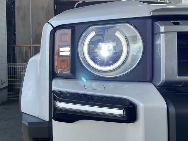 トヨタ ランドクルーザー ２５０ VX 徳島県 2024(令6)年 0.4万km プラチナホワイトパールマイカ サンルーフ/ヘッドランプ（丸目）/12.3インチ純正ディスプレイオーディオナビ /・フルセグTV /・Bluetooth/・Miracast/・USB/HDMI/パノラミックビューモニター/パワーシート（D+N席）/シートヒーター/エアシート（D+N席）/モデリスタ/・シグネチャーイルミブレード/・フェンダーガーニッシュ/・バックドアガーニッシュ/サイドステップ/マッドフラップ（赤）/ルーフレール/BSM/レーダークルーズコントロール/レーンキープアシスト/前後コーナーセンサー/LEDヘッドライト/オートライト/オートマチックハイビーム/フロントフォグランプ/ウィンカーミラー/Wサイドエアバッグ/カーテンエアバッグ/ナノイー