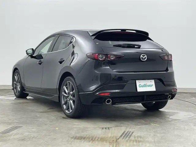 マツダ マツダ３ファストバック 15S ツーリング 岡山県 2021(令3)年 1.2万km ジェットブラックマイカ 純正エアロ（F/S/R）/8.8インチマツダコネクトナビ/地デジ/BT/CD/DVD/USB/HDMI/360度セーフティパッケージ/スマートブレーキサポート/レーンキープアシスト/レーダークルーズコントロール/ブラインドスポットモニター/ヘッドアップディスプレイ/ビルトインETC/純正前後ドラレコ /オートハイビーム /LEDヘッドライト/純正フロアマット /プッシュスタート /スマートキー
