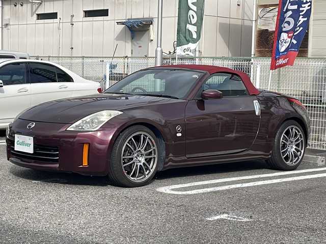 日産 フェアレディ Ｚ ロードスター バージョンT 兵庫県 2006(平18)年 4.9万km プレミアムミスティックマルーン 登録時走行距離49002km/純正DVD(カーウィングス対応)/バックカメラ/ブラック革シート/シートヒーター（運転席/助手席）/パワーシート（運転席/助手席）/ETC/BOSEサウンドシステム/HIDヘッドランプ/ビスカスLSD/電動オープン